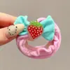 Coloridos coleteros de nuevo estilo 2026, versátiles y dulces, con accesorios de M&M's, anillos de toalla, diseños de dibujos animados y un estilo fresco y lindo, perfectos para accesorios para el cabello de niños