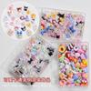 Accesorios para uñas, venta al por mayor, caja ciega mixta, resina de dibujos animados, tamaño lazo, hielo transparente, Aurora, juego de decoraciones para uñas, caja