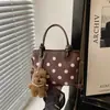 Moda fuente de fábrica transfronteriza 2026 nuevo diseño de lunares en nailon bolso de mano casual para el día a día bolso de hombro tipo cubo
