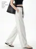 Pantalones de traje personalizados para hombre alto talla extra, de seda de hielo, contraste blanco y negro, corte estrecho, diseño transfronterizo y patronaje de fábrica de ropa de muestra