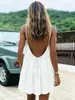2026 Comercio exterior transfronterizo europeo y americano Amazon vestido corto de color liso con fruncido de seda helada sin espalda con tirantes vestido de vacaciones en la playa para mujer