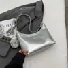 Bolso de axila tipo 'dumpling' texturizado de moda coreana, nicho, para mujer, nuevo simple de hombro y cruzado, primavera 2026