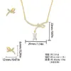 Set de Aretes y Collar de Cobre Perlado Brillante con Nudo de Cinta, No se Desvanece, Joyería de Lujo Ligero de Alta Gama para Mujer, Joyería al por Mayor Transfronteriza