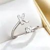 El producto transfronterizo más vendido de TEMU: Anillo de moda para mujer con 26 letras inglesas microincrustadas de circonita, anillo abierto liso de cobre chapado en 14K