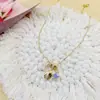 Collar de acero de titanio con forma de concha de estrella de mar de alta calidad, venta caliente transfronteriza, joyería con colgante de circón colorido exquisito para mujer, cadena para la clavícula