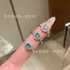Suministro directo al por mayor de fábrica anillo de jade azul de material natural peligroso incrustación de plata s925 diseño de lujo ligero para mujer