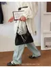 Bolso Tote Yozzi 2026 Modelo Nuevo de Primavera Color Sólido Estilo Coreano Gran Capacidad Bolso de Mano para Viajes Cotidianos Bolso de Hombro Casual Elegante