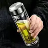 Vaso de vidrio templado irrompible con apertura de un botón, gran capacidad, separación de té y agua, adecuado para hombres y mujeres, y cuenta con un botón pulsador para una operación rápida