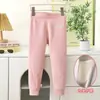 Nuevos pantalones térmicos protectores de rodilla para niños de otoño e invierno para niños y niñas, leggings engrosados con calefacción de cintura alta, pantalones esenciales para uniforme escolar para niños