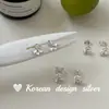 Brincos versáteis de design nicho estilo ins coreano, brincos de tarraxa flor de íris em prata de lei S925, requintados, compactos e de luxo leve