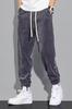 Pantalones de pana casuales para hombre, forrados de vellón para otoño e invierno, pantalones deportivos versátiles, pantalones deportivos gruesos, sueltos y cálidos con cordones en los tobillos.