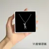 [56] logotipo de comercio exterior sin marca acero de titanio joyería Europa y Estados Unidos variedad de hip-hop apilado collar de clavícula de acero de titanio