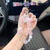 Cadena para Teléfono de Cuentas Redondas de Cristal Mate Degradado con Colgante de Flor 3D Llavero Versátil para Niñas y Bolsos