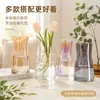 Jarrón de vidrio electrochapado de lujo ligero, recipiente transparente moderno y simple para flores hidropónicas, decoración de alto valor estético para sala de estar y mesa de comedor