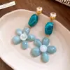 Pendientes redondos de flor de resina con aguja de plata, pendientes de estilo étnico retro exagerado de nicho, pendientes de lujo ligero de alta gama al por mayor