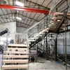 Fabricantes de Foshan Producción Personalizada de Escaleras de Estructura de Acero Escaleras con Peldaños de Acero y Madera de Roble Rojo Barandilla de Cristal Bilateral