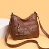 Nueva bolsa bandolera tejida de gran capacidad de moda transfronteriza, versión coreana, simple y elegante, bolsa para mamá de cuero suave con múltiples compartimentos para mujer
