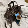 Bolsas Femininas 2026 Novo Estilo Coreano Bolsa de Mão de Luxo Pequena Nicho Bolsa de Ombro Transversal para Menina Bolsa Quadrada Pequena Versátil