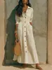 Colección de otoño 2026 europea y americana: Vestido largo blanco de alta gama, ajustado en la cintura, corte holgado, ropa para mujer talla grande, un artículo popular para ventas transfronterizas