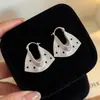 Elegante HerederaEstilo Fresco Bolso de Lunares Plateados Arete Arete Único Mujer 2026 Aretes Súper Hermosos