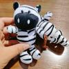 Suministro transfronterizo de juguetes de peluche, llavero de león con colgante pequeño y bolsa de dibujos animados, joyería de muñeca animal al por mayor