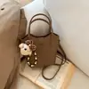 Bolsa Cesta de Legumes Estilosa Feminina Outono 2026 Nova Moda de Alto Padrão Bolsa de Ombro Único Transversal Bolsa de Mão Tipo Balde