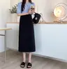 Traje de maternidad falda midi 2026 nuevo moda primavera y otoño abrigo para mamá cintura alta adelgazante longitud media línea A falda corta