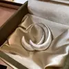 Nuevo producto transfronterizo europeo y americano: pendientes ovalados cepillados con un diseño de nicho, colgantes de oreja modernos y únicos de moda