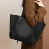 Bolsa de Mano 2026 Estilo Nuevo Lona para Mujer Sensación de Alta Gama Gran Capacidad Bolso de Hombro para Viajero Bolso Grande Equipaje