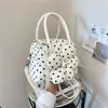 Bolso de mano de moda transfronterizo con lunares frescos, bolso tipo concha versátil de diseño nicho y moderno, bolso cruzado casual dulce con estampado floral