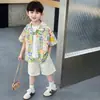 Traje de Verano de Manga Corta para Niños 2026 Estilo Nuevo Fresco y Elegante Camisa Floral Infantil Conjunto de Dos Piezas de Moda para Niños en Verano