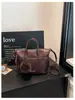 Bolso tipo cubo de diseño nicho estilo coreano consciente del diseño para mujer 2026 nuevo lanzamiento de verano bolso de mano bolso cruzado bolso de hombro simple para el día a día