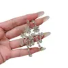 Pendientes elegantes y delicados de estilo francés con diamantes brillantes, diseños florales y de lágrima, y borlas para mujer; moderno, simple, de nicho y versátil