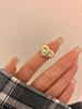 Anillo abierto con incrustaciones de diamantes y diseño en relieve de ojos de amor de nicho europeo y americano, anillo de pareja de lujo ligero de otoño e invierno para mujer