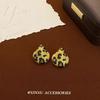 Nuevos aretes geométricos de amor leopardo otoño e invierno retro sentido de alta gama aretes nicho personalidad aretes chica hot mujer al por mayor