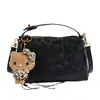 Bolso de axila nuevo retro con estampado de leopardo 2025 para mujer, un bolso de mano de nicho, ligero y lujoso que se puede llevar en la mano, usar al hombro o cruzado, y es versátil para cualquier atuendo