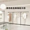 Nueva tienda de ropa negra tienda de ropa para mujer tienda de ropa para niños estantería de exhibición de pared a piso estantería de exhibición perchero de pared a lateral para colgar ropa
