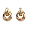 Pendientes de Metal con Temperamento Europeo y Americano para Mujer Círculo Dorado Nicho Lujo Ligero Moda Pendientes de Gama Alta Venta al por Mayor