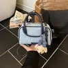 Moda Transfronteriza Simple y Versátil Primavera 2026 Nuevo Estilo Alta Calidad Diseño de Nicho Bolso Pequeño Cuadrado Cruzado de un Solo Hombro para Mujer