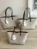 Bolso retro sencillo para mujer, nuevo modelo 2026, bolso tote de alta gama, bolso de hombro y axila de gran capacidad para el trabajo