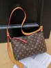 Bolsa de mano para desplazamientos transfronterizos, elegante y estilosa, bolso de alta gama para mujer 2026, gran capacidad, nuevo y versátil bolso de hombro y cruzado