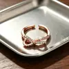 Anillo de plata de ley 925 con un exquisito lazo, estilo coreano, moderno, único, diseño creativo, anillo abierto incrustado de diamantes para mujer