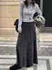Saia Midi Plissada de Lã Cinza Estilo Francês de Alta Qualidade para o Inverno de 2026 com Silhueta Fluida e Elegante