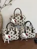 Bolso de Lunares de Nicho Súper Popular para Mujer 2026 Modelo Nuevo Bolso Cruzado Versátil para el Trabajo con Sensación de Bolso de Mano Bolso Almohada