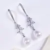 Pendientes largos de perlas de lujo elegantes transfronterizos nuevos pendientes finos para cara de dama gancho pendientes colgantes e2341