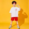 Me encantan los uniformes de actividad de primaria de China, los atuendos de porrista para el día del deporte juvenil, las faldas plisadas rojas y las camisetas.