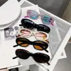 Gafas de sol ovaladas para niños de Corea del Sur alta gama moda forma cóncava simple gafas de sol para niños y niñas