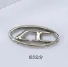 Imagem Original DisponívelAtacado do Fabricante Metal Oco Acabamento em Óleo Preto Ferragens Fivela Decorativa para Roupas e Chapéus, Oval Costurada à Mão