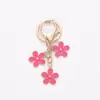 Venta Caliente Transfronteriza Creativo DIY Aleación Flor de Doble Cara Estilo Ins Llavero de Flor Colorida Colgante para Estuche de Auriculares Venta al por Mayor