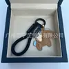 Dinero en el Caballo Cuero de Vaca Creativo Exquisito Casual Regalo de Pareja Bolso Lindo Colgante Llavero de Coche Llavero